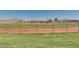 Well-maintained baseball field ready for a game with mountain views in the background at 17743 W Verdin Rd, Goodyear, AZ 85338