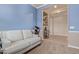 This bedroom features neutral carpet, base trim, and a view into the hallway at 17743 W Verdin Rd, Goodyear, AZ 85338