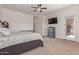 Bright bedroom features soft carpet, ceiling fan, and a sliding glass door to the backyard at 17743 W Verdin Rd, Goodyear, AZ 85338