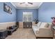 This bedroom has neutral carpet and a view of the outdoors at 17743 W Verdin Rd, Goodyear, AZ 85338