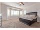 Bright bedroom with large windows, providing ample natural light, and plush carpeting at 17743 W Verdin Rd, Goodyear, AZ 85338