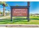 Estrella Yacht Club community sign with palm trees and lush green grass at 17743 W Verdin Rd, Goodyear, AZ 85338