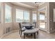 Bright dining area with scenic views, featuring a modern round table and comfortable bench seating at 17743 W Verdin Rd, Goodyear, AZ 85338