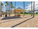 Picnic pavilion and barbecue area surrounded by palm trees and manicured landscaping at 17743 W Verdin Rd, Goodyear, AZ 85338