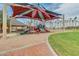 Community playground with colorful structures, shade canopies, and nearby pavilions at 17743 W Verdin Rd, Goodyear, AZ 85338