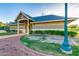 Exterior of a public restroom facility, complete with neutral paint, landscaping, and a brick path at 17743 W Verdin Rd, Goodyear, AZ 85338