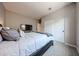 Neutral bedroom featuring plush carpet, a large closet with sliding doors, and a TV stand at 17893 W Indigo Brush Rd, Goodyear, AZ 85338