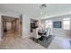 Elegant dining room with a large table, comfortable seating, and neutral colors offers a serene ambiance at 17893 W Indigo Brush Rd, Goodyear, AZ 85338