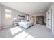 Serene main bedroom with soft carpet, large windows, and a calming color palette creates a relaxing retreat at 17893 W Indigo Brush Rd, Goodyear, AZ 85338