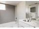 Bright bathroom featuring modern fixtures, tiled walls, and a built-in bathtub and shower at 2030 N 17Th Ave, Phoenix, AZ 85007