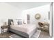 Relaxing bedroom with a cozy rug, desk and ample natural light, creating a tranquil and inviting space at 2030 N 17Th Ave, Phoenix, AZ 85007