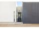 Modern home entrance with contrasting white and gray walls and glass front door at 2030 N 17Th Ave, Phoenix, AZ 85007