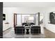 Modern living room with sleek furniture, high ceilings, and large windows, creating a sophisticated and inviting space at 2030 N 17Th Ave, Phoenix, AZ 85007