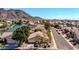 A stunning aerial view capturing the home's prime location near a lake, with mountain views at 20615 N 55Th Ave, Glendale, AZ 85308