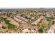 Wide aerial shot capturing a residential area near a golf course and lake, highlighting the community's landscape and homes at 20615 N 55Th Ave, Glendale, AZ 85308