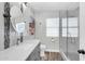 Bathroom featuring glass enclosed shower, modern vanity, and wood-look floors at 20615 N 55Th Ave, Glendale, AZ 85308