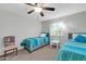 Bright bedroom with two twin beds, plush bedding, and a window for natural light at 20615 N 55Th Ave, Glendale, AZ 85308