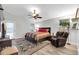 Bedroom featuring neutral walls, ceiling fan, and wood-look flooring at 20615 N 55Th Ave, Glendale, AZ 85308