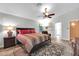 Bedroom featuring neutral walls, ceiling fan, and wood-look flooring at 20615 N 55Th Ave, Glendale, AZ 85308