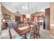 Living and dining room featuring open concept with kitchen island with bar seating at 20615 N 55Th Ave, Glendale, AZ 85308