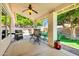 Relaxing covered patio featuring a ceiling fan, outdoor seating, and a grill at 20615 N 55Th Ave, Glendale, AZ 85308