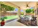 Cozy covered patio area with a putting green visible in the backyard at 20615 N 55Th Ave, Glendale, AZ 85308