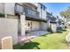 Exterior shot of the unit featuring a covered patio, lush lawn, and beautiful outdoor living at 2338 W Lindner Ave # 22, Mesa, AZ 85202