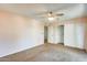 Bedroom featuring neutral walls, carpeting, ceiling fan, and closet at 2338 W Lindner Ave # 22, Mesa, AZ 85202