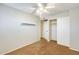 Bedroom featuring neutral walls, carpeting, ceiling fan, and closet at 2338 W Lindner Ave # 22, Mesa, AZ 85202