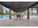 The covered patio near the community pool offers shade and a place to relax at 2338 W Lindner Ave # 22, Mesa, AZ 85202