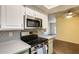 Kitchen featuring stainless oven, stone counters, and easy access to the living room at 2338 W Lindner Ave # 22, Mesa, AZ 85202