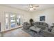 Cozy living room featuring French doors to the outdoors, comfortable seating, and a decorative area rug at 2338 W Lindner Ave # 22, Mesa, AZ 85202