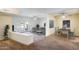 Open living room with plush carpet, stylish furniture, ceiling fan, and sliding glass doors to outdoor area at 2338 W Lindner Ave # 22, Mesa, AZ 85202