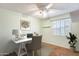 Bright office featuring a ceiling fan, a dedicated workspace, and natural light from the window at 2338 W Lindner Ave # 22, Mesa, AZ 85202
