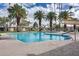 Inviting community pool with palm trees and lounge chairs, perfect for relaxation and enjoying the outdoors at 2338 W Lindner Ave # 22, Mesa, AZ 85202