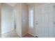 Bright entryway featuring tile floors and a storm door at 2433 E Hancock Trl, Casa Grande, AZ 85194