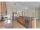 Well-lit kitchen showcasing granite countertops, stainless steel appliances, and ample cabinet space at 2433 E Hancock Trl, Casa Grande, AZ 85194