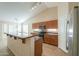 Open kitchen featuring stainless steel appliances and granite countertops, perfect for entertaining at 2433 E Hancock Trl, Casa Grande, AZ 85194