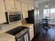 A stainless steel microwave and electric cooktop add appeal to this updated kitchen at 2905 E Montecito Ave, Phoenix, AZ 85016