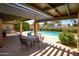 A view of the community swimming pool and covered patio at 2905 E Montecito Ave, Phoenix, AZ 85016