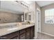 Bathroom featuring double sinks, granite countertops, tile floor, and a walk-in shower at 314 N 79Th Pl, Mesa, AZ 85207