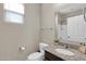 Bright bathroom featuring granite countertops, a sink, and updated fixtures at 314 N 79Th Pl, Mesa, AZ 85207