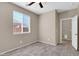 Neutral bedroom featuring tile floors, a ceiling fan, and a bright window at 314 N 79Th Pl, Mesa, AZ 85207