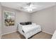 Bedroom featuring a ceiling fan, large window, and daybed at 314 N 79Th Pl, Mesa, AZ 85207