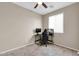 Neutral bedroom featuring tile floors, ceiling fan, and a bright window at 314 N 79Th Pl, Mesa, AZ 85207