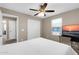 Bedroom featuring a ceiling fan, large window, and television at 314 N 79Th Pl, Mesa, AZ 85207