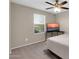 Bedroom featuring a ceiling fan, large window, and television at 314 N 79Th Pl, Mesa, AZ 85207