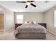 Cozy bedroom featuring neutral walls, carpet, a ceiling fan, and an ensuite bathroom at 314 N 79Th Pl, Mesa, AZ 85207