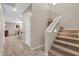 Inviting entryway with tile flooring, coat closet, staircase, and open view to the dining and living areas at 314 N 79Th Pl, Mesa, AZ 85207