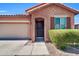 Charming two-story home with a well-maintained front yard, covered entry, and a two car garage at 314 N 79Th Pl, Mesa, AZ 85207